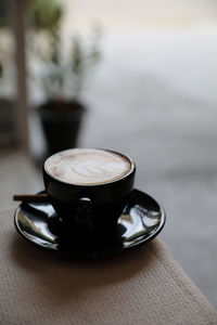 High angle view of coffee cup on table