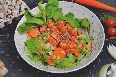 High angle view of chopped fruits in plate on table