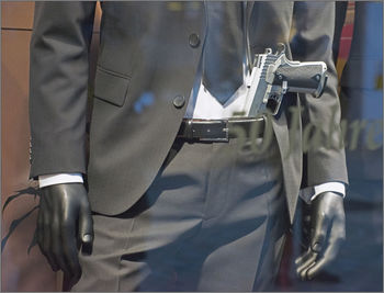 Close-up of mannequin and gun