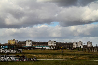 Buildings in distance with landscape in foreground