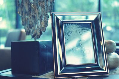 Close-up of hand on glass window