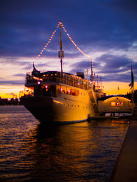 View of ship in sea against sky during sunset