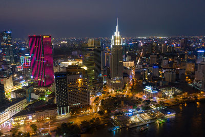 High angle view of illuminated buildings in city at night