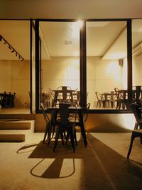 Empty chairs and tables in restaurant