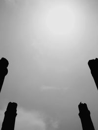 Low angle view of silhouette statue against clear sky