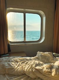 Scenic view of sea against sky seen through window