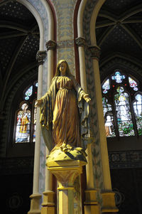 Statue in temple against building