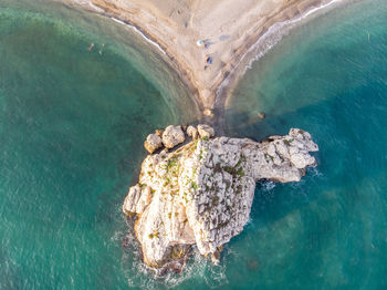 High angle view of rock formation in sea