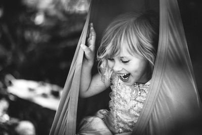 Close-up of cute girl playing outdoors