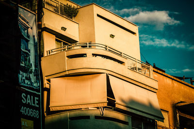 Low angle view of illuminated building against sky