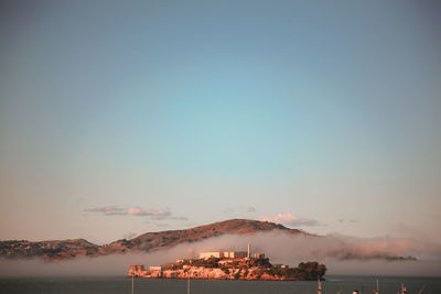 Scenic view of the alcatraz prison  against sky during sunset