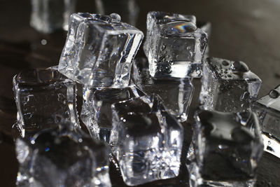 Close-up of ice cubes on table