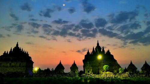 Silhouette of temple against sky during sunset