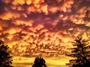 Low angle view of cloudy sky at sunset