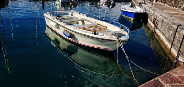 High angle view of fishing boats moored in sea