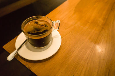 High angle view of coffee cup on table