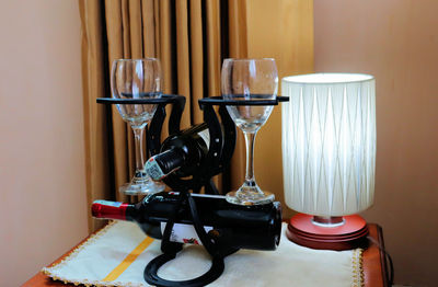 Close-up of wine glasses on table