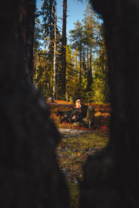 A man in autumn forest colours.