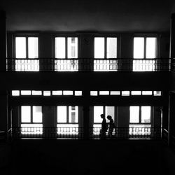 Woman looking through window