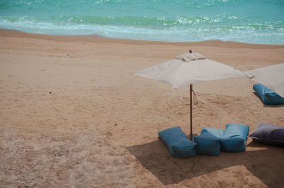 High angle view of parasols on shore at beach