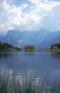 Scenic view of lake against cloudy sky