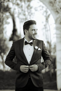 Portrait of young man standing outdoors