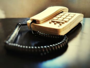 Close-up of old-fashioned telephone on table