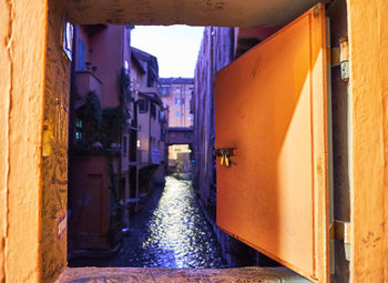 Narrow alley amidst buildings in city