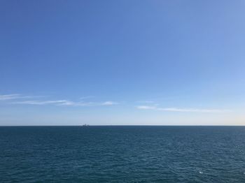 Scenic view of sea against blue sky