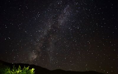 Low angle view of stars in sky at night