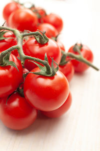 Cherry tomatoes bunch isolated on white