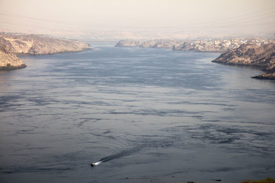 Scenic view of river against sky during winter