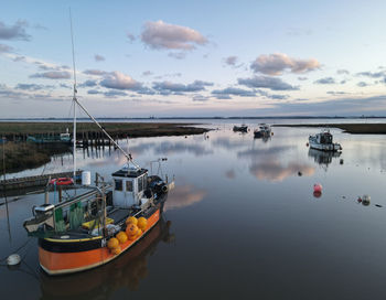 Small fishing boats moored at stone creek inlet, sunk island, east yorkshire, uk