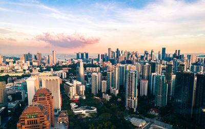 Aerial view of cityscape against sky during sunset