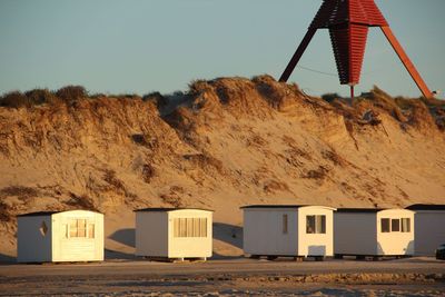 Lifeguard hut on beach against clear sky