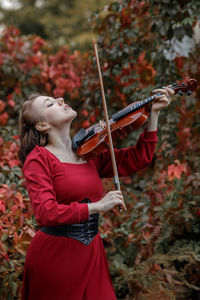 Young woman playing violin