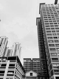 Low angle view of buildings against sky in city