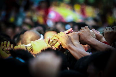 Group of people holding rope outdoors