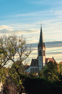 View of buildings against cloudy sky