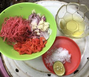 High angle view of chopped fruits in bowl on table