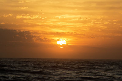 Scenic view of sea at sunset