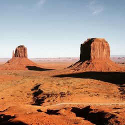 Rock formations in desert against sky