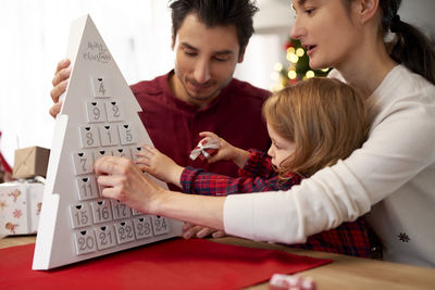 Family playing game at table