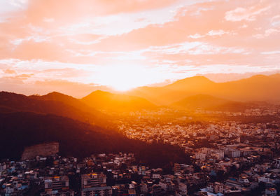 Aerial view of townscape against sky during sunset