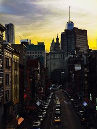 Road along buildings at sunset