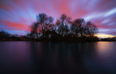 Scenic view of lake at sunset