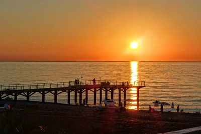 Scenic view of sea against orange sky