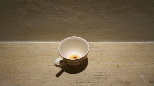 High angle view of illuminated tea light on table