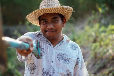 Portrait of young man wearing hat