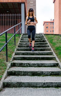 Full length of woman on staircase